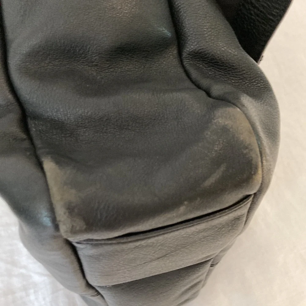 Tumi leather messenger tech lots of pockets